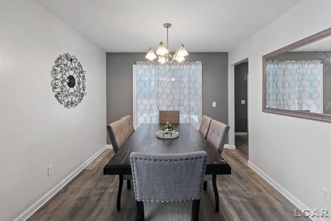 Gray LVP vinyl flooring in a dining room