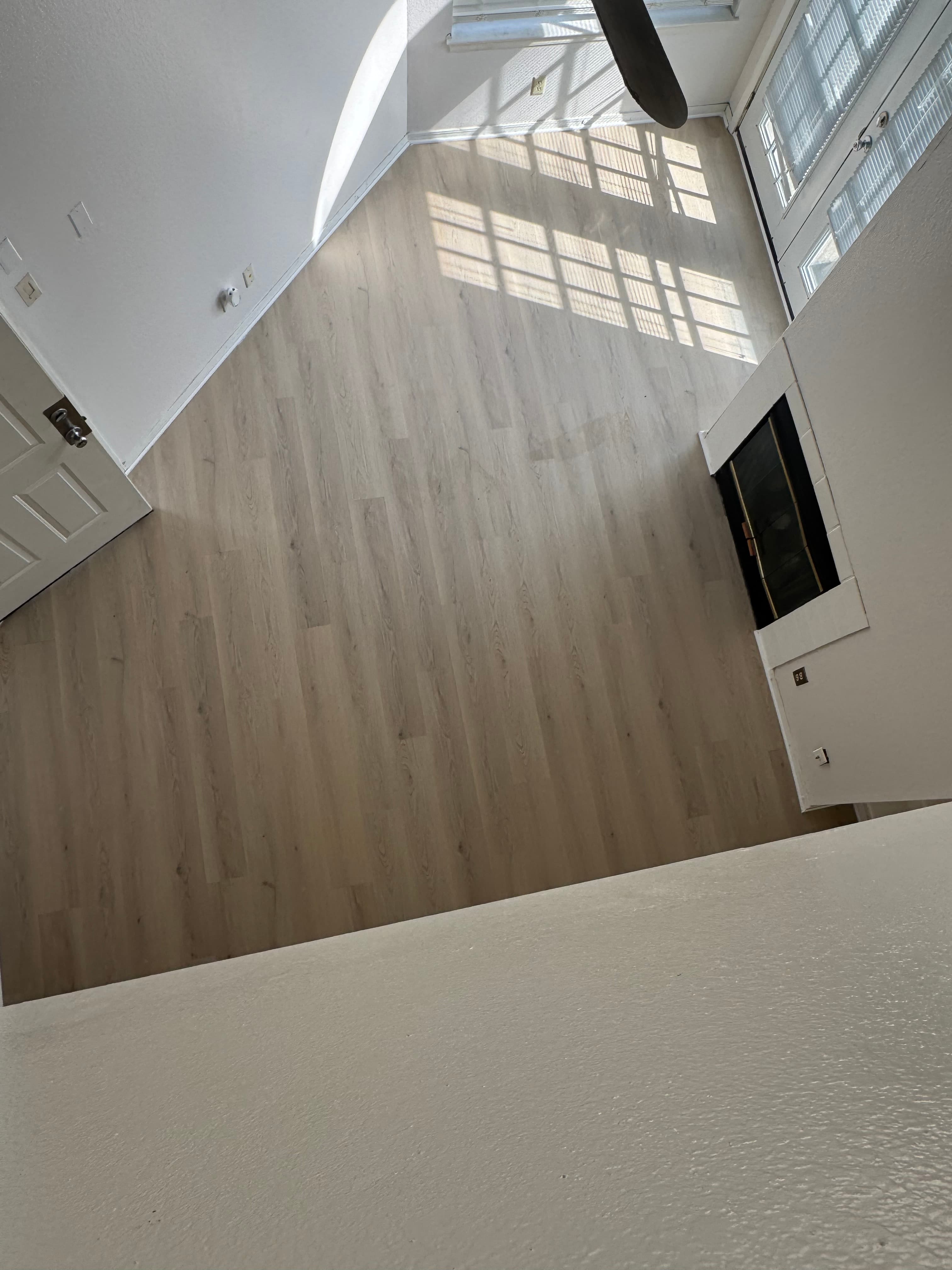 LVP vinyl flooring in a living room, lighter brown tone