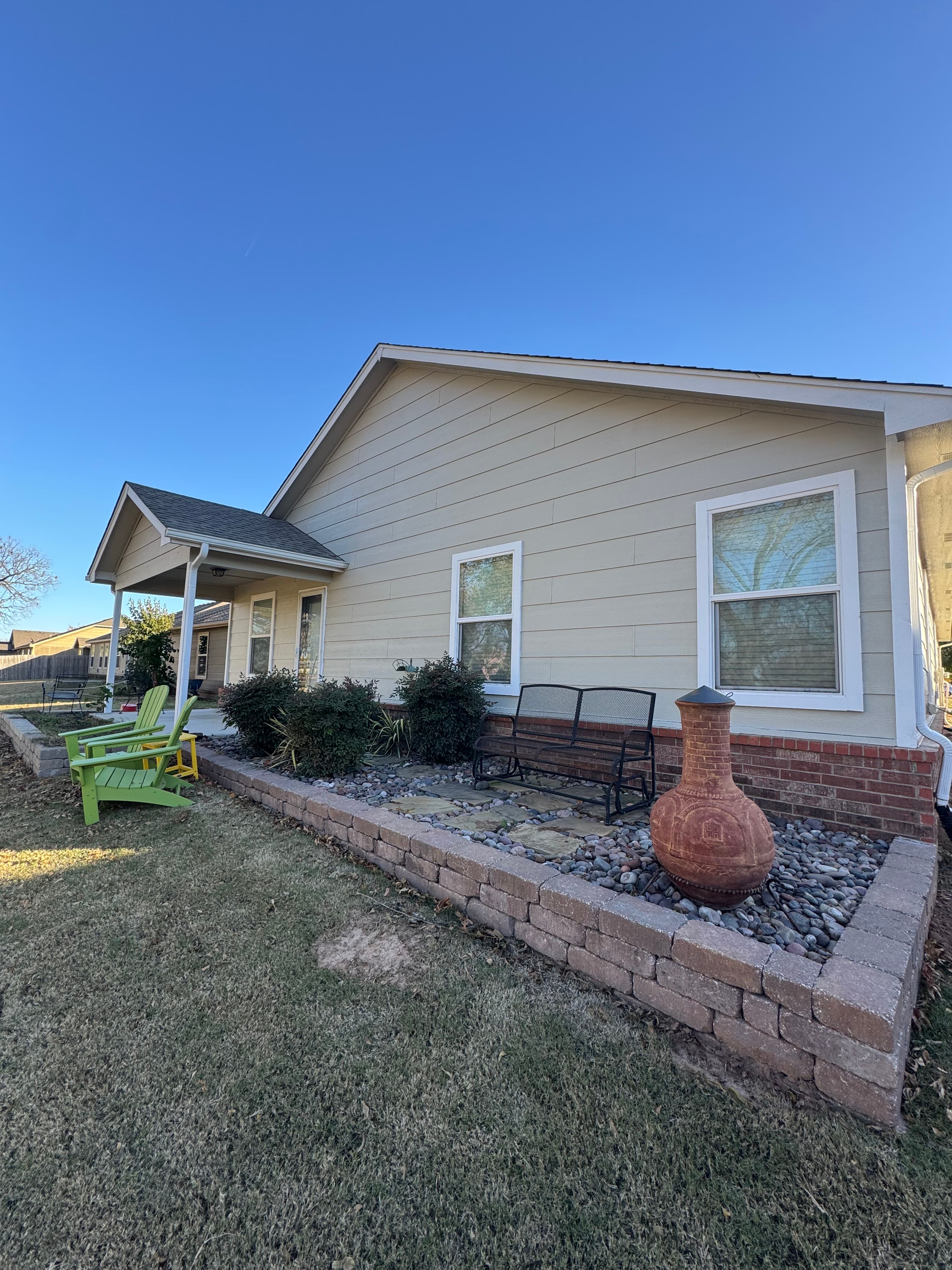 Home exterior with fresh yellow siding
