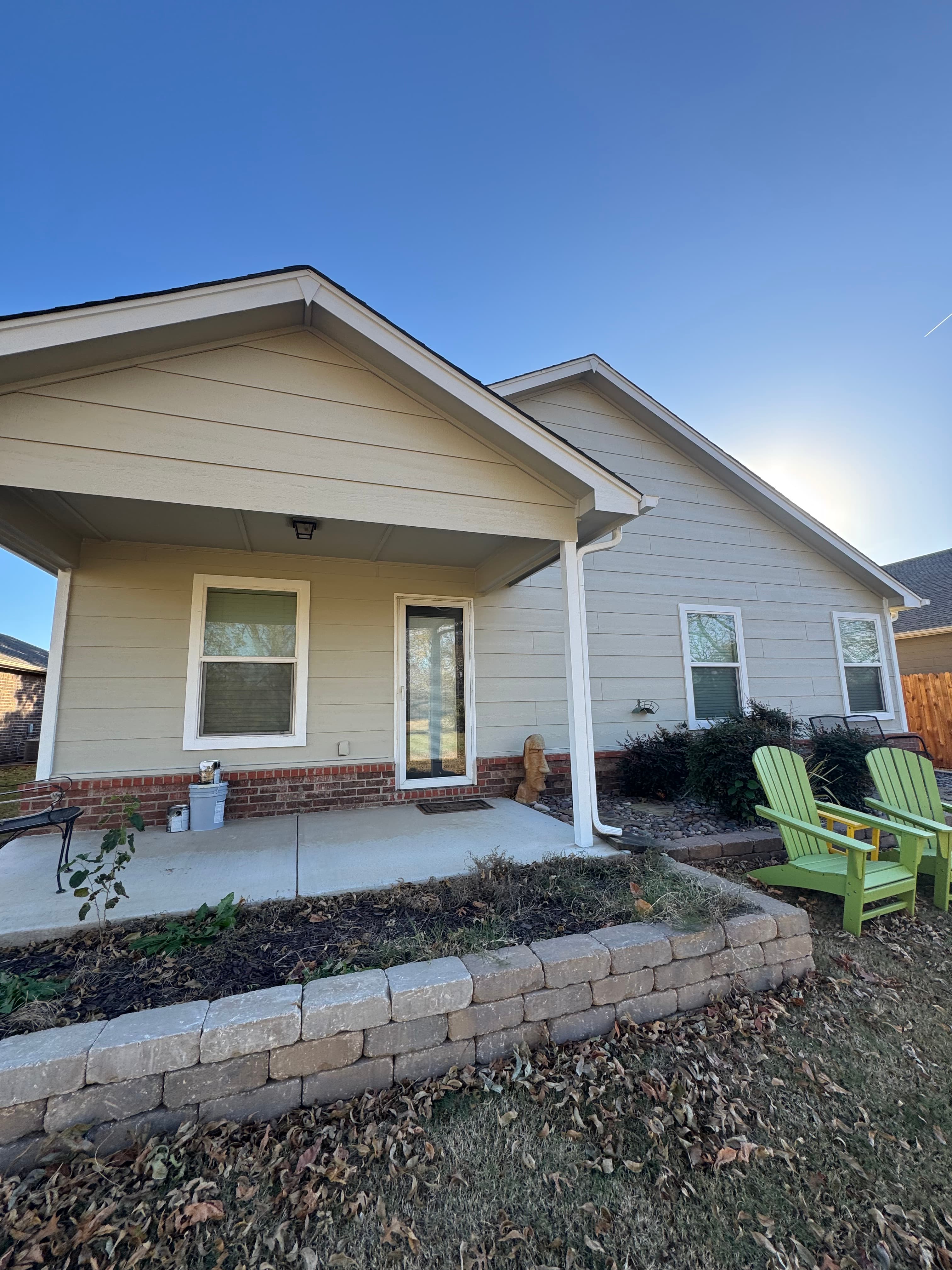 Yellow siding installation on a Tulsa-metro home